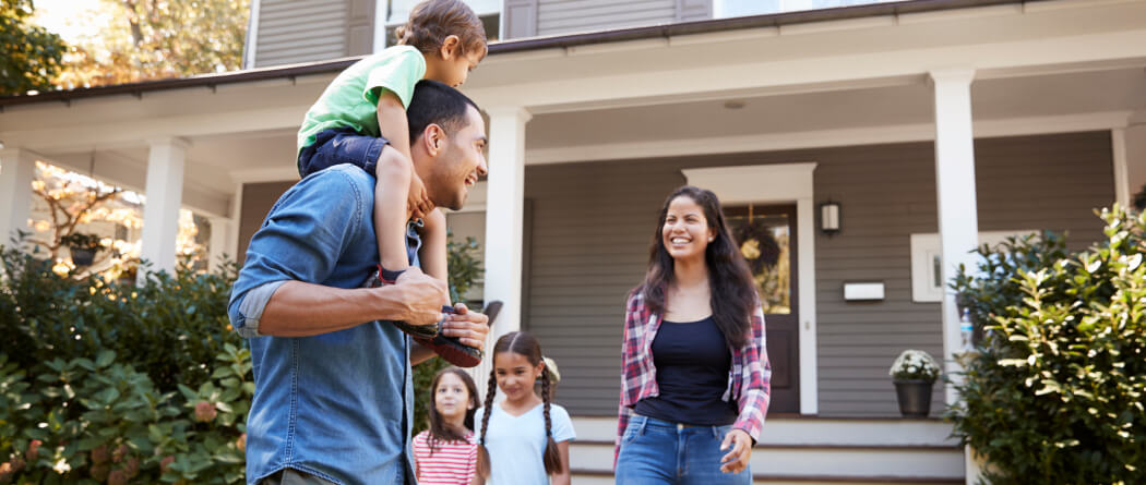 Family in front of home